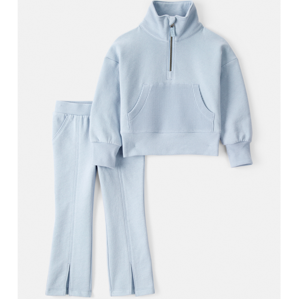 Light blue fleece pullover and pants set on a white background