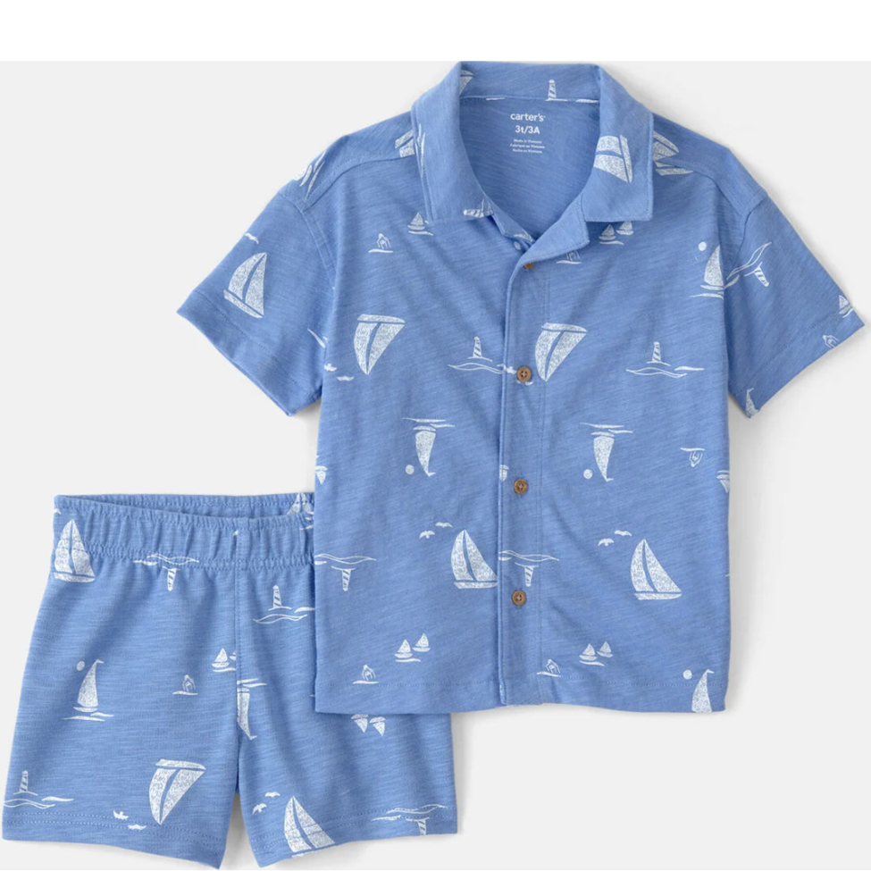 Blue children's shirt and shorts set with sailboat pattern on a white background