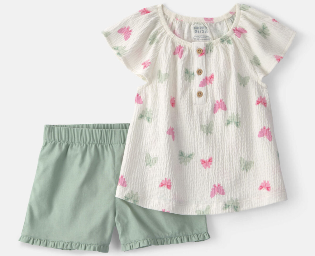 Floral top and green shorts set on a white background