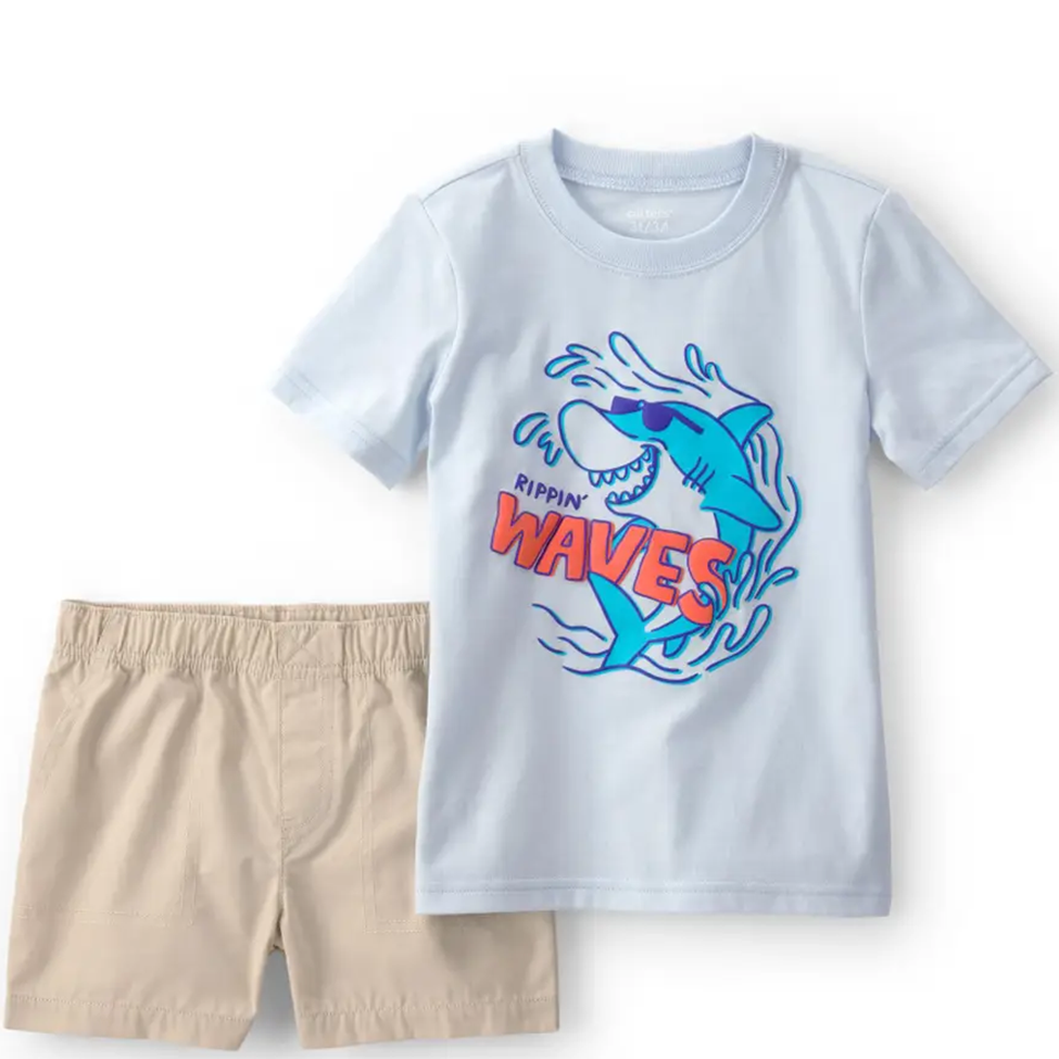 Children's t-shirt with shark graphic and shorts on a white background