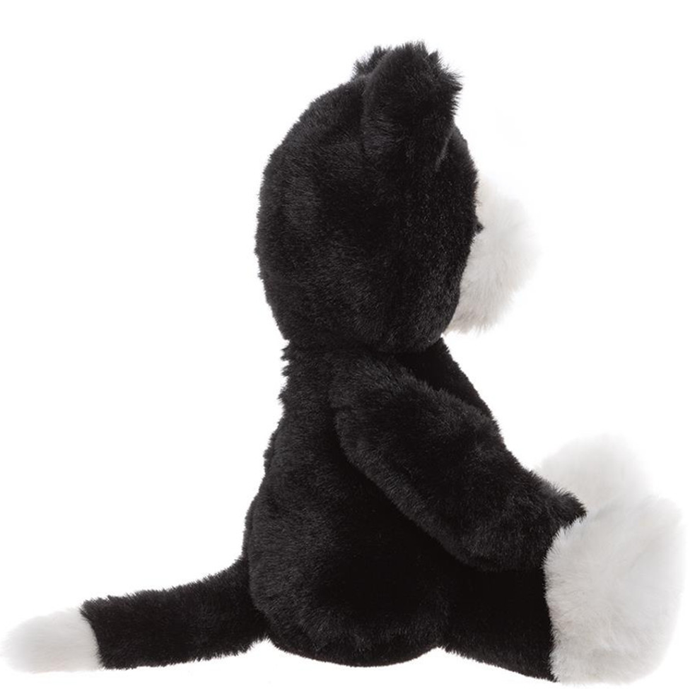 Black and white plush toy on a white background