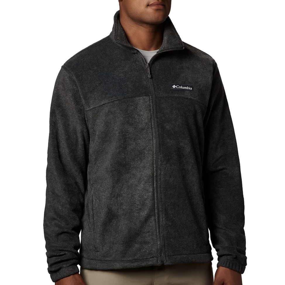 Person wearing a dark gray fleece jacket with Columbia logo on a white background