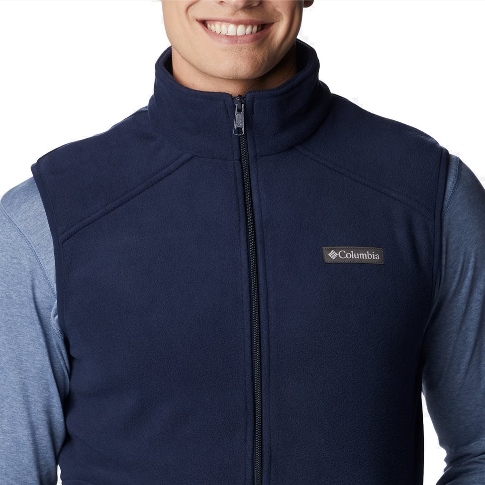 Navy blue vest with Columbia logo worn by a person on a white background