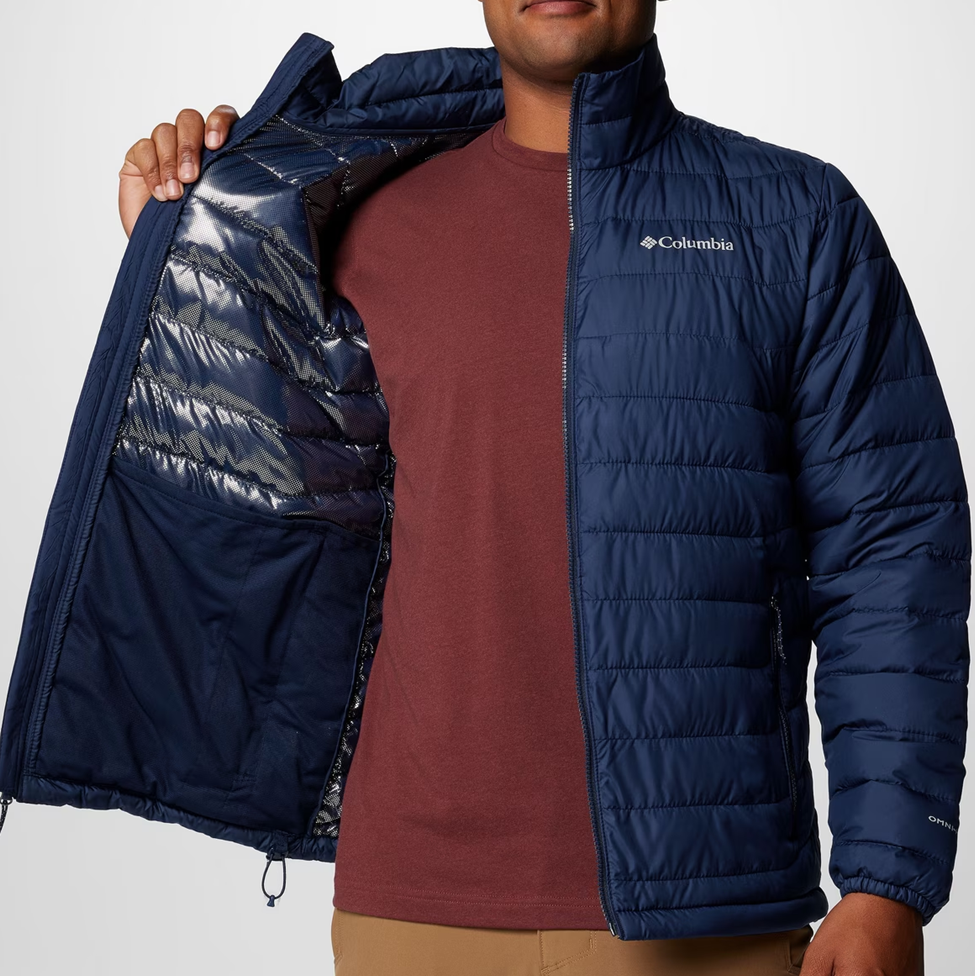 Person wearing a blue puffer jacket with Columbia logo on a white background