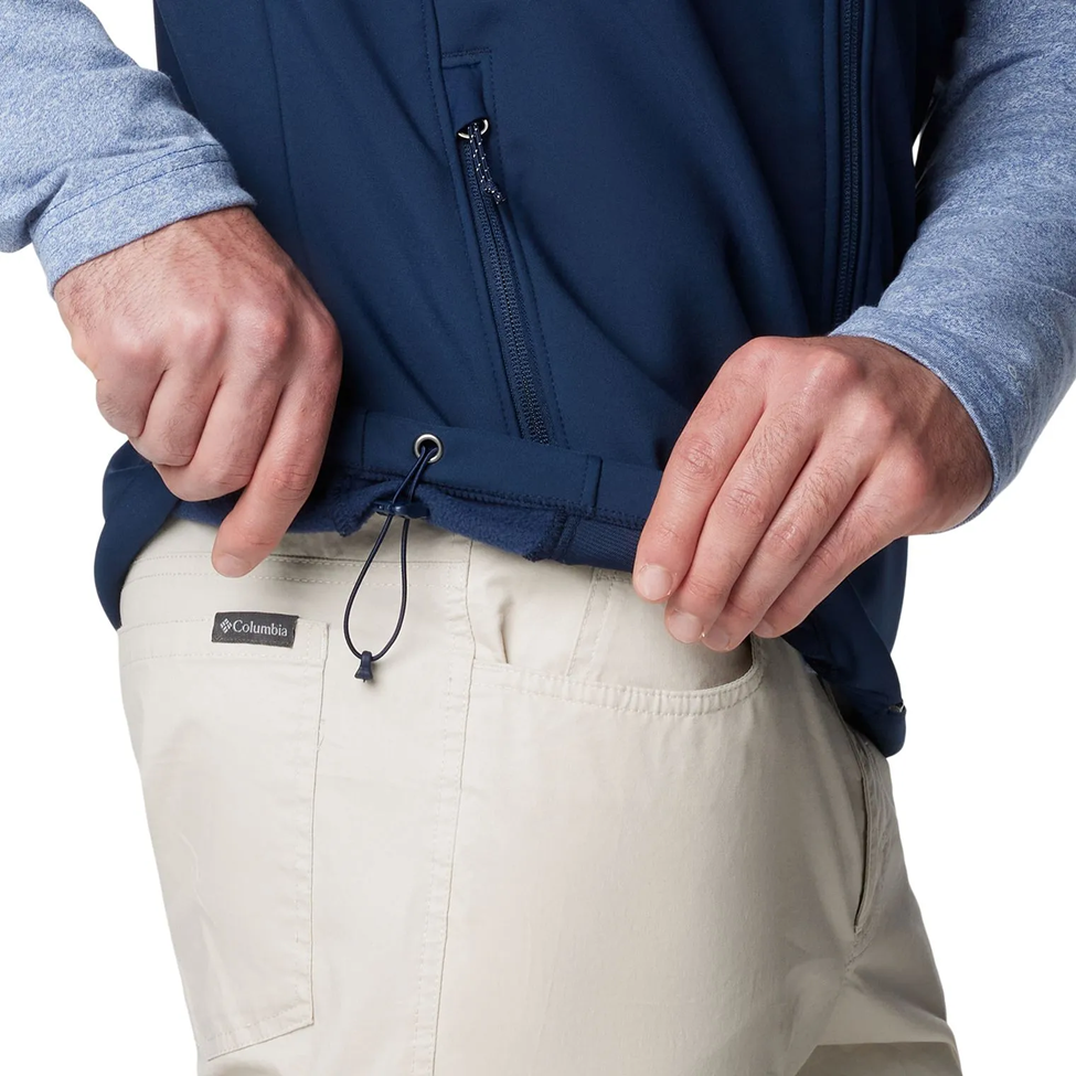 Person wearing a blue jacket and beige pants with Columbia logo