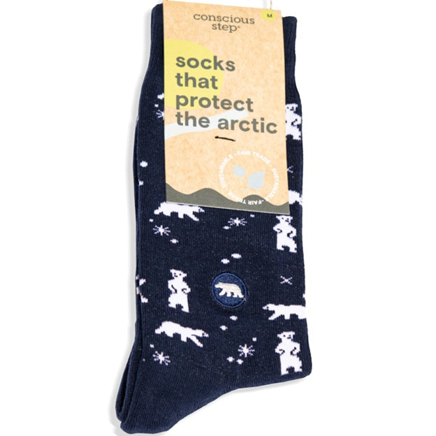 Navy blue socks with polar bear design and 'Conscious Step' packaging on a white background