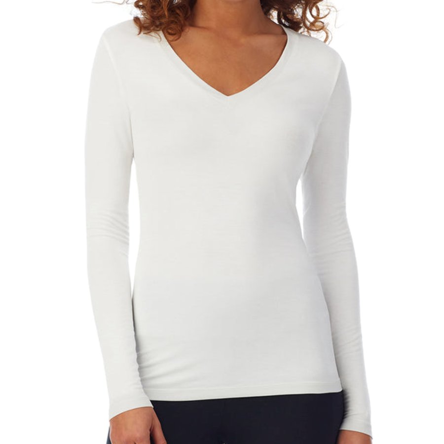 White long-sleeve top worn by a person on a white background