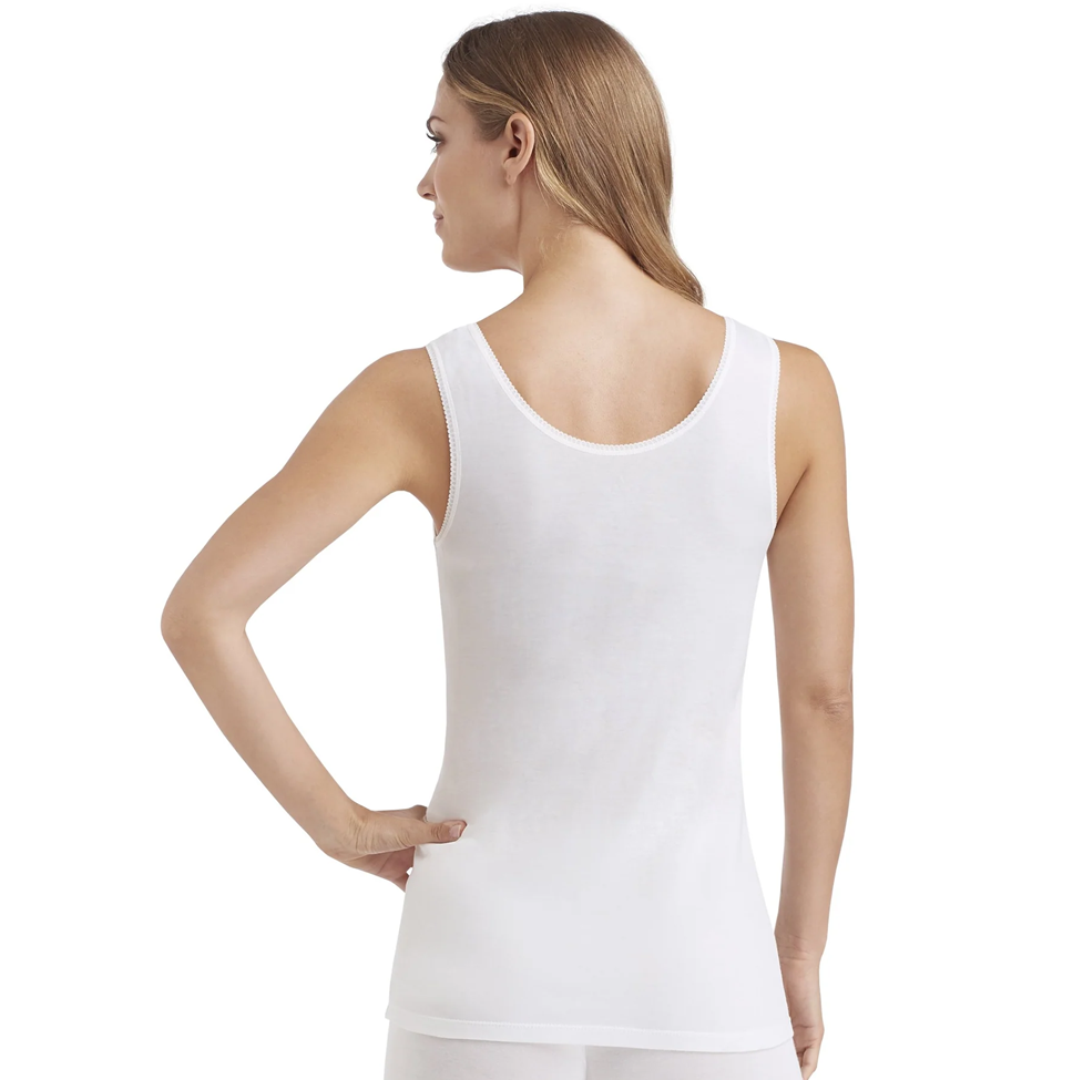 Woman wearing a white tank top on a white background