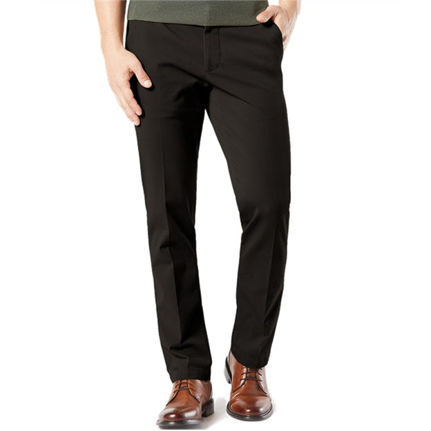 Black pants worn by a person on a white background