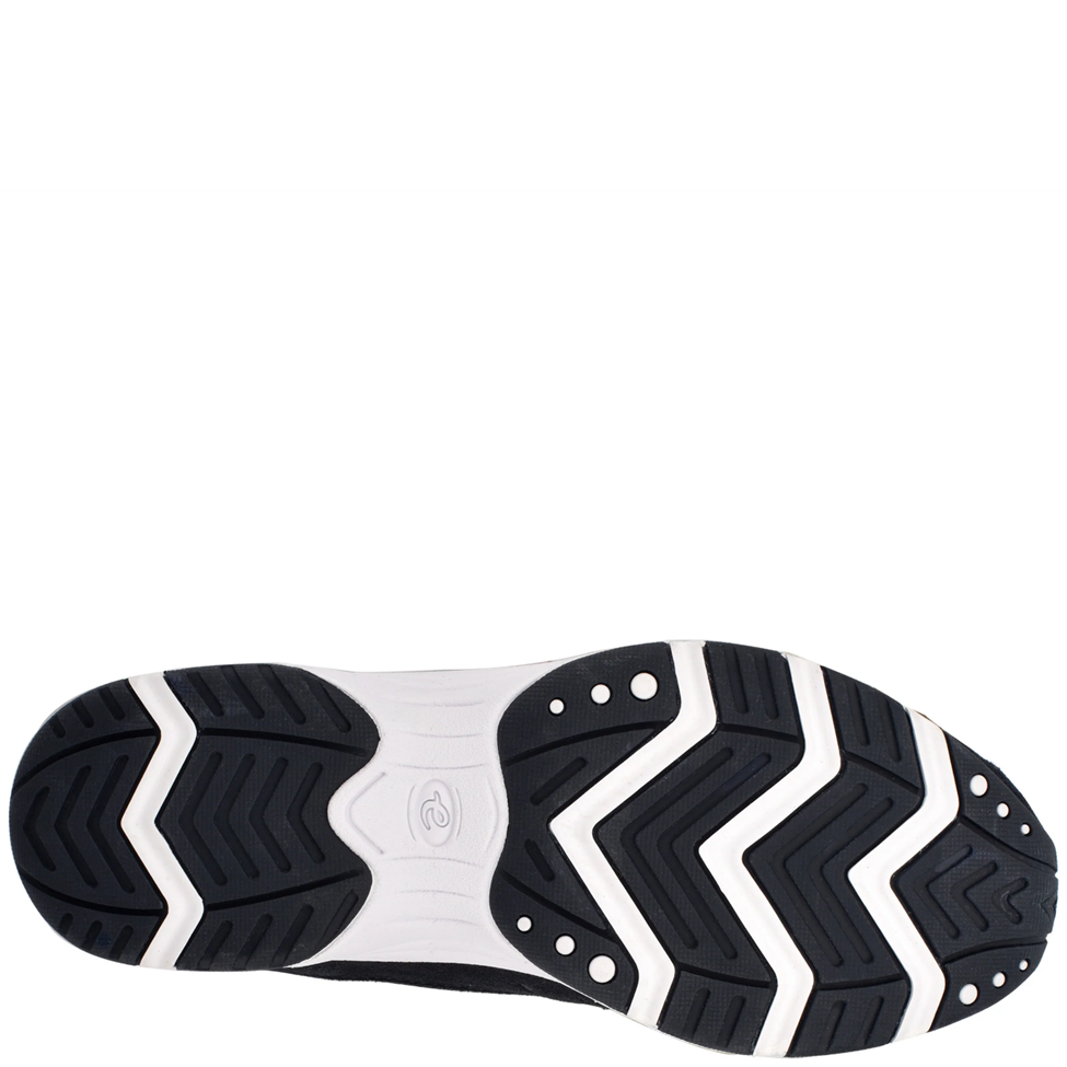 Close-up of a shoe sole with black and white tread pattern on a white background