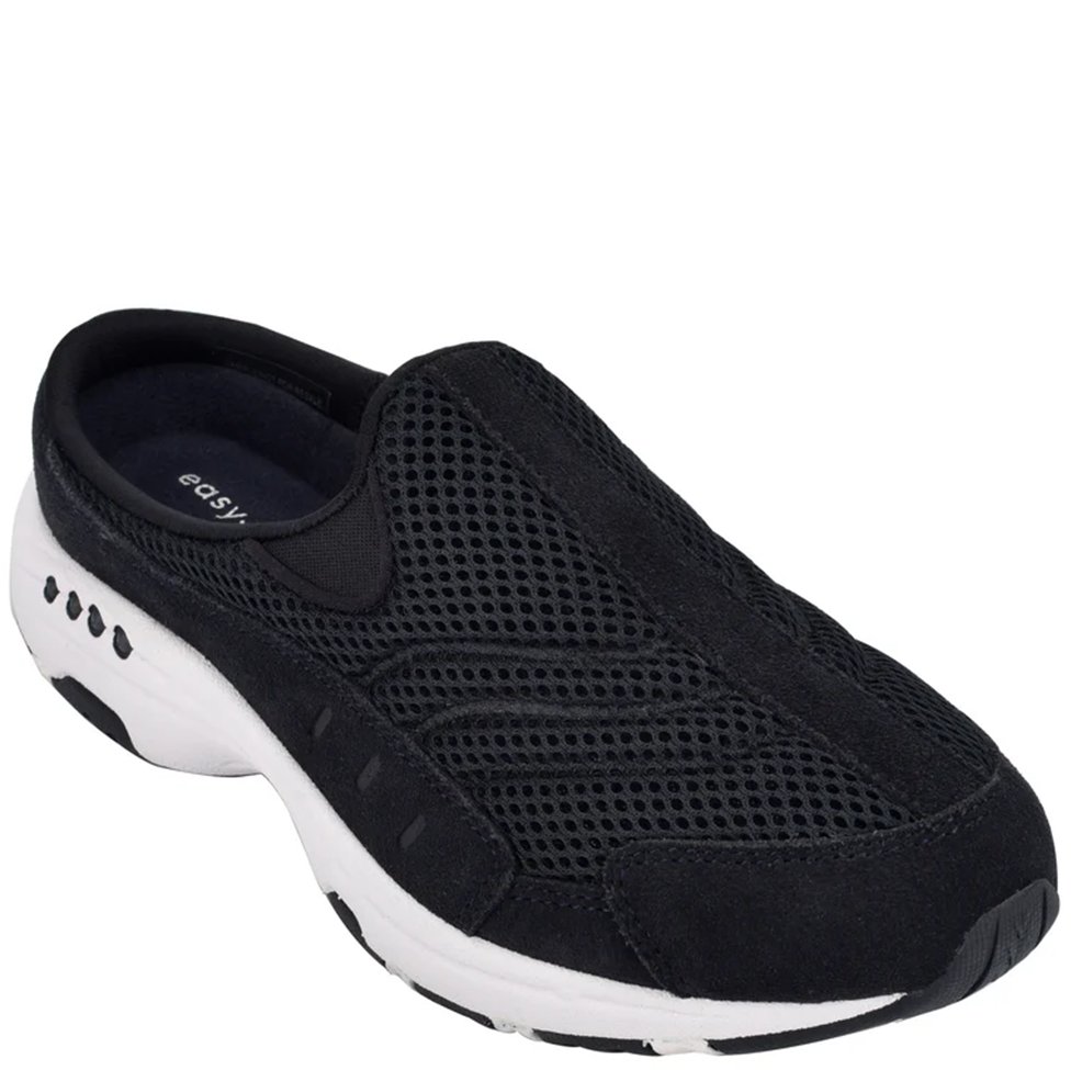 Black slip-on shoe with white sole on a white background