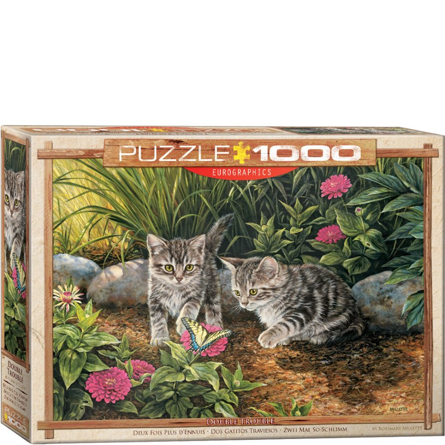 Jigsaw puzzle box with two kittens and a butterfly on a natural background