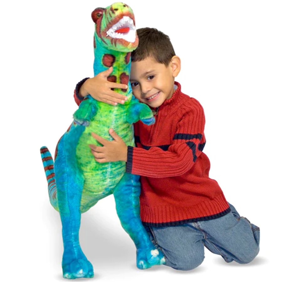 Child hugging a colorful dinosaur toy on a white background