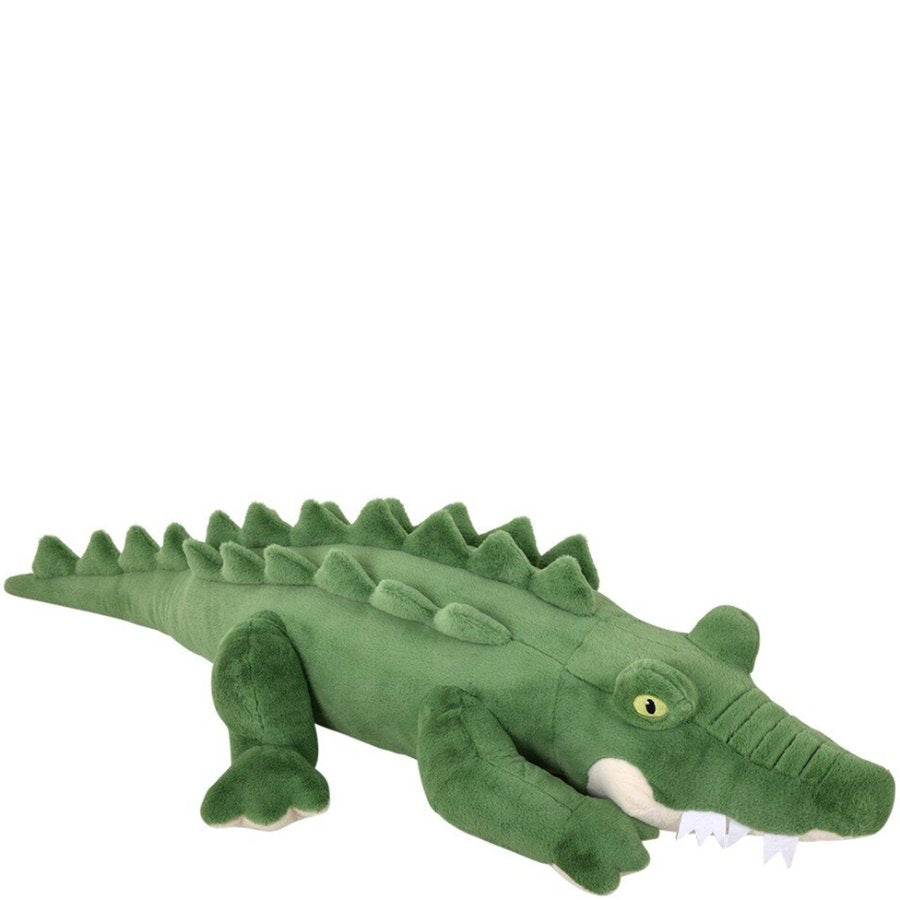 Green plush alligator toy on a white background