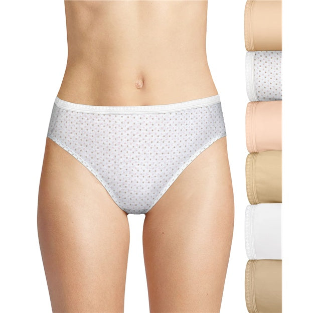 White polka dot underwear worn by a person with additional pairs stacked on the right.
