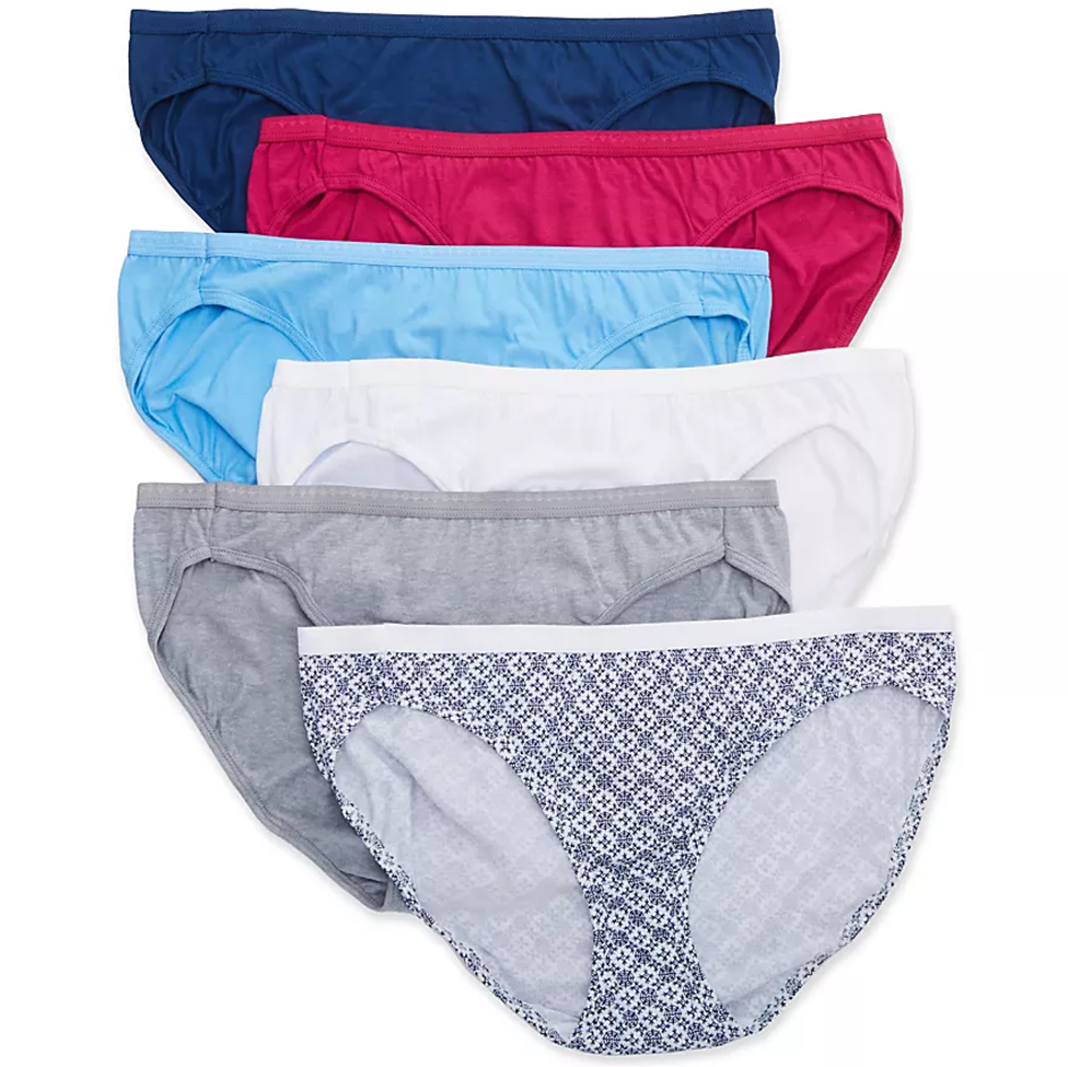 Set of women's underwear in various colors on a white background