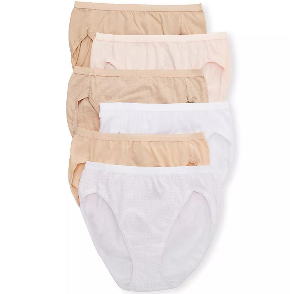Set of women's underwear in beige and white on a white background