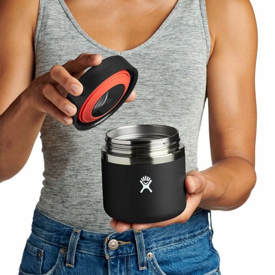 Black thermos with silver lid on a white background