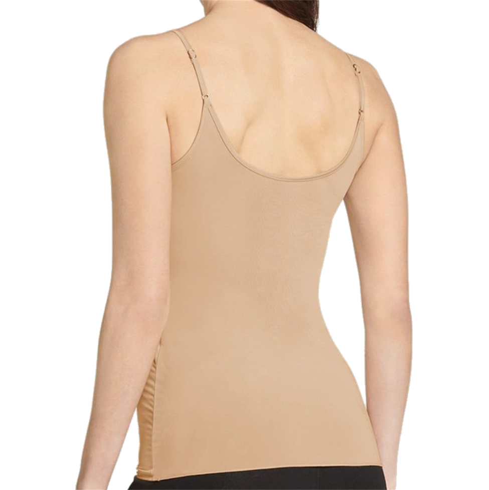 Beige tank top worn by a person on a white background