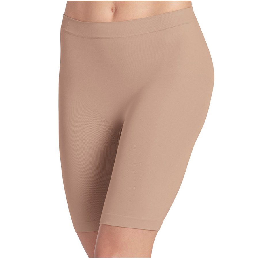 Beige capri leggings on a white background