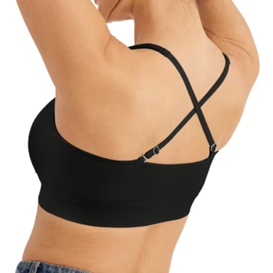 Black strappy top worn by a person on a white background