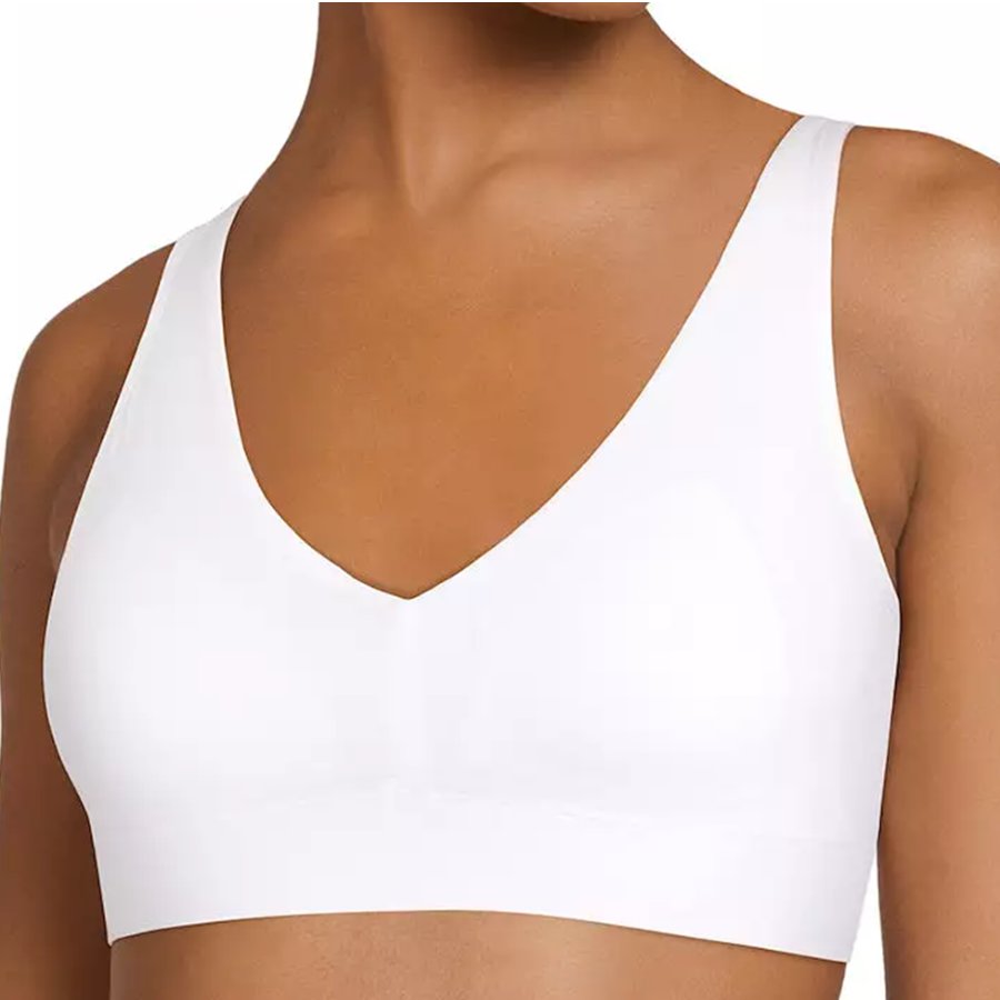 White sports bra worn by a person on a white background