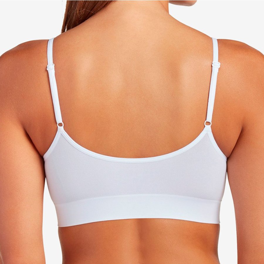 White bra on a model with a neutral background