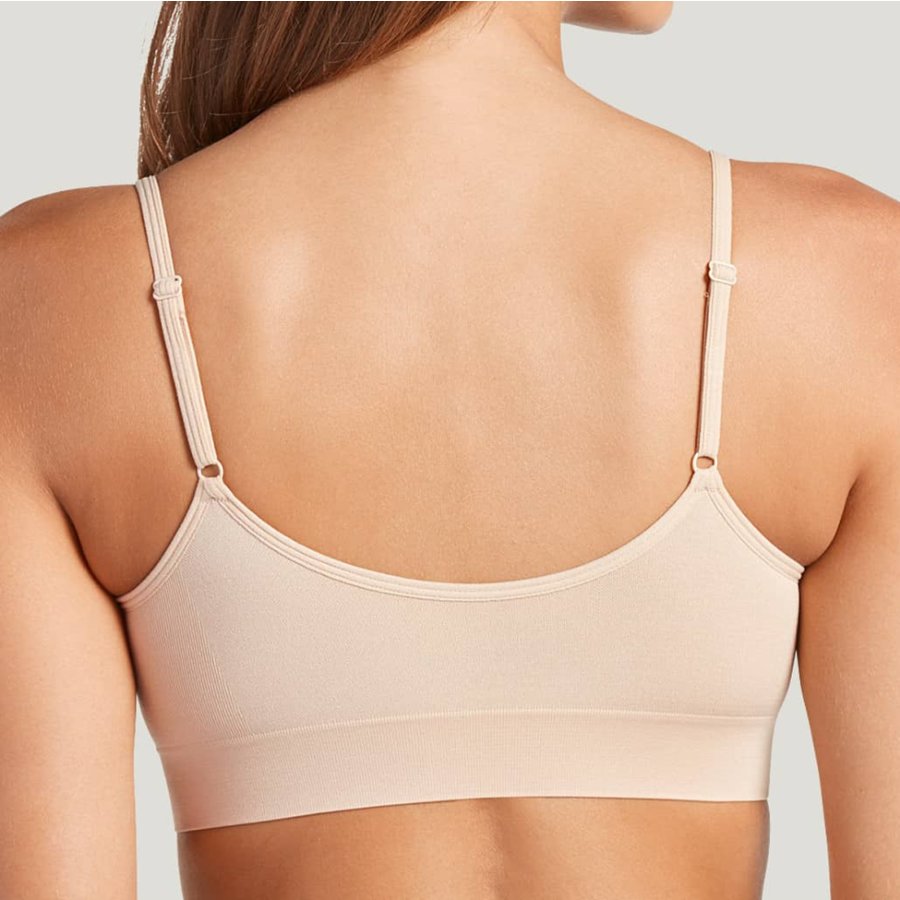 Beige bra on a plain background