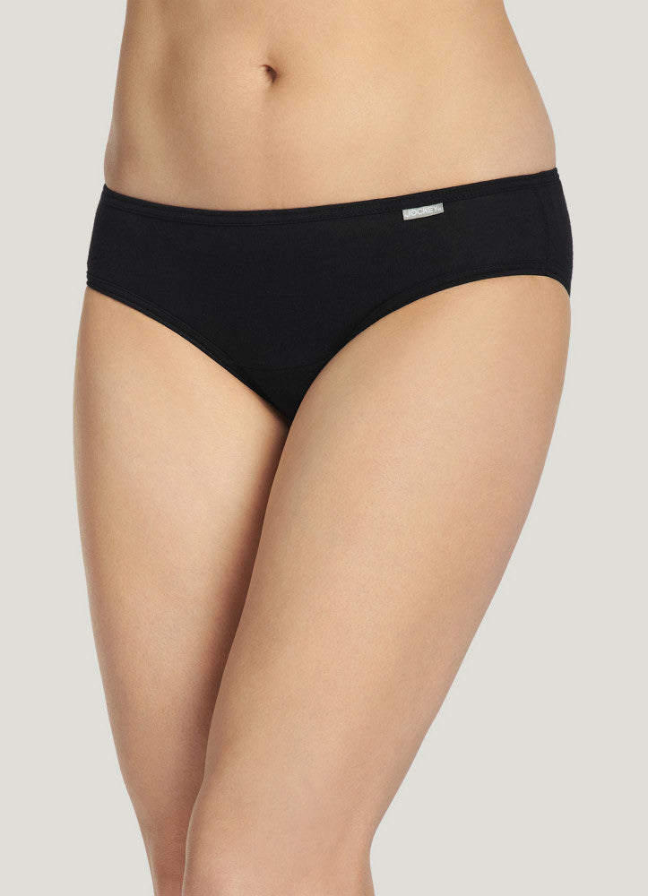Black underwear worn by a person on a plain background
