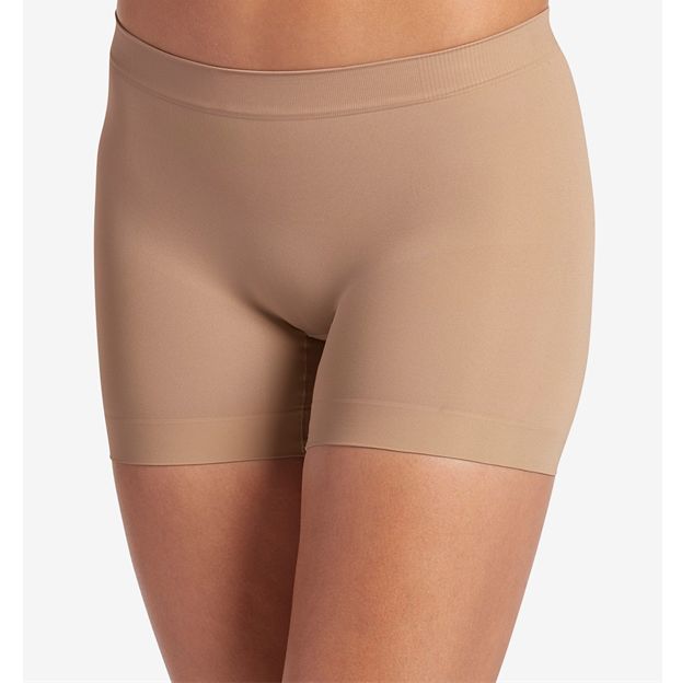 Beige shorts worn by a person on a white background