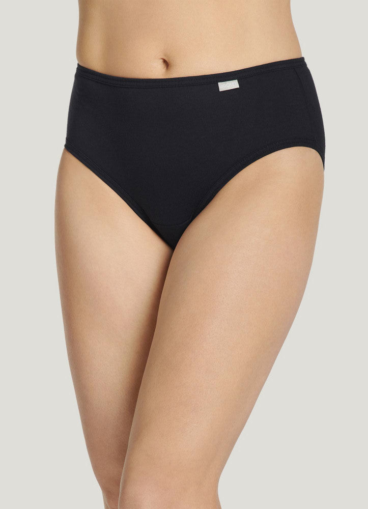 Black high-waisted underwear worn by a person on a light gray background