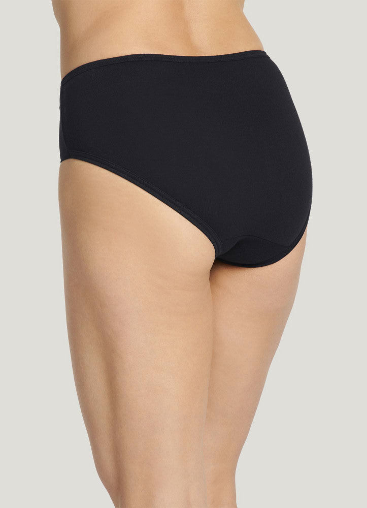 Black high-waisted underwear worn by a person on a light gray background