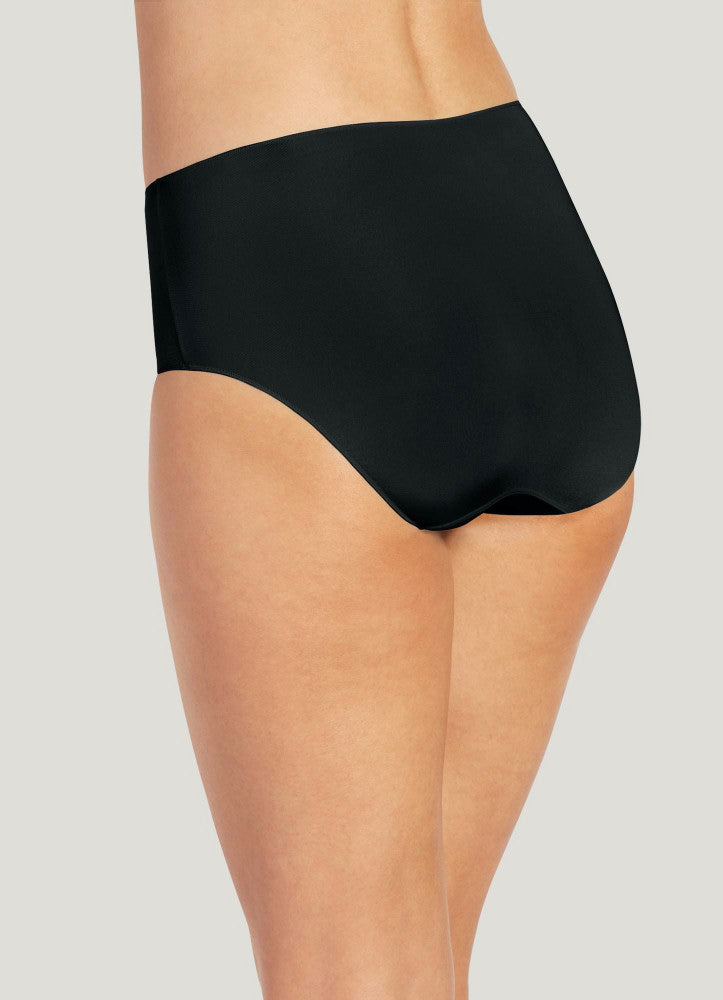 Black high-waisted underwear worn by a person on a light gray background