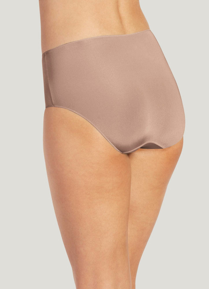 Beige high-waisted underwear on a plain background