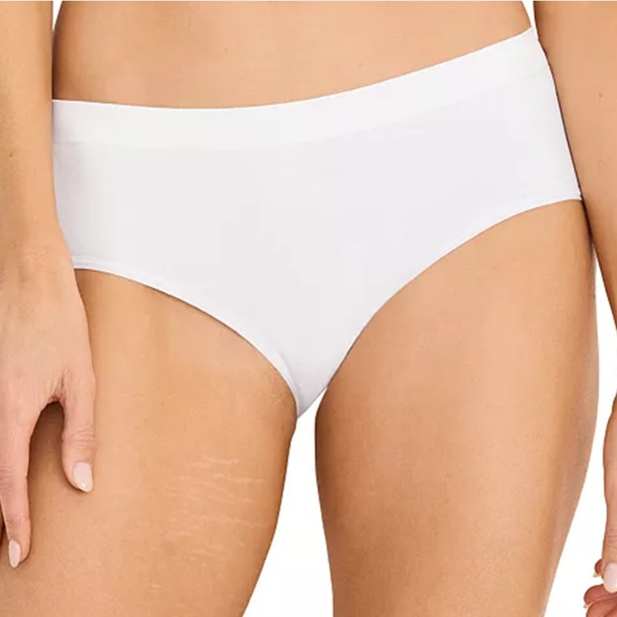 White underwear worn by a person on a plain background