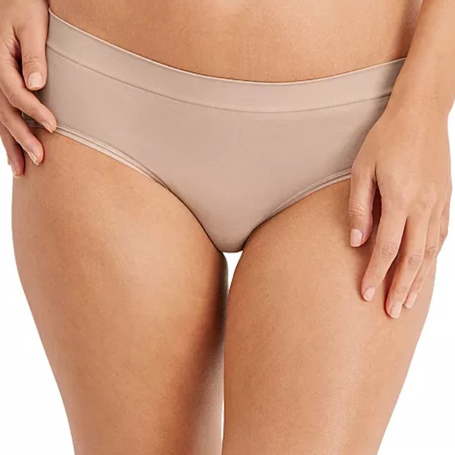 Beige underwear worn by a person on a white background