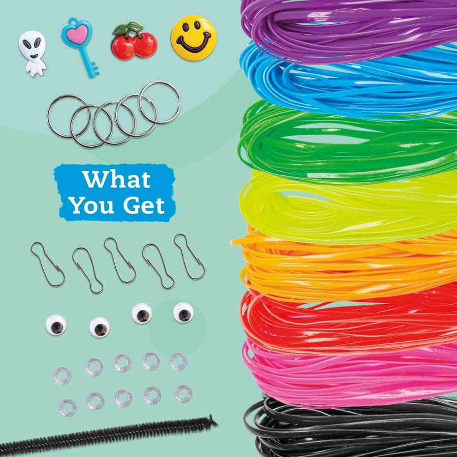 Assorted craft supplies including colorful elastic bands, small rings, googly eyes, and a black straw on a light blue background.