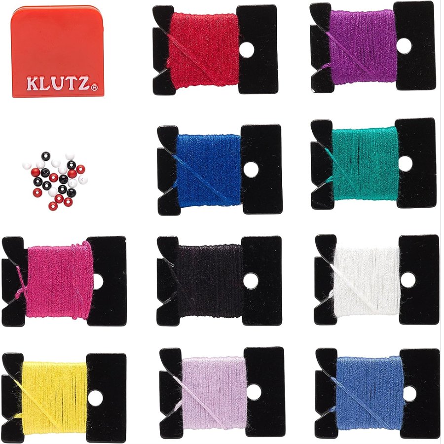 Colorful thread spools with KLUTZ branding on a white background