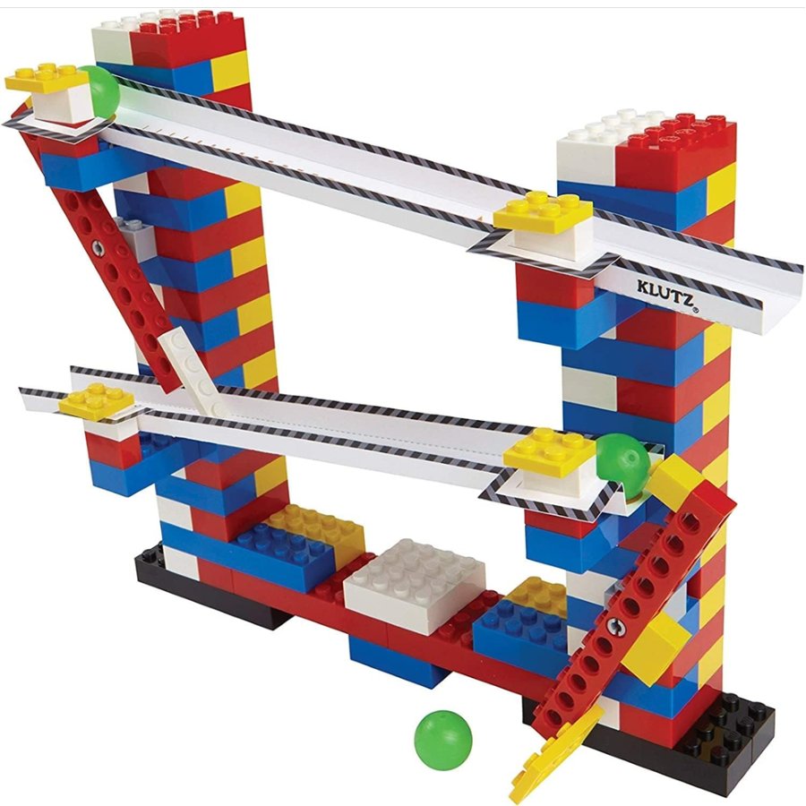 Colorful toy building set with tracks and ramps on a white background