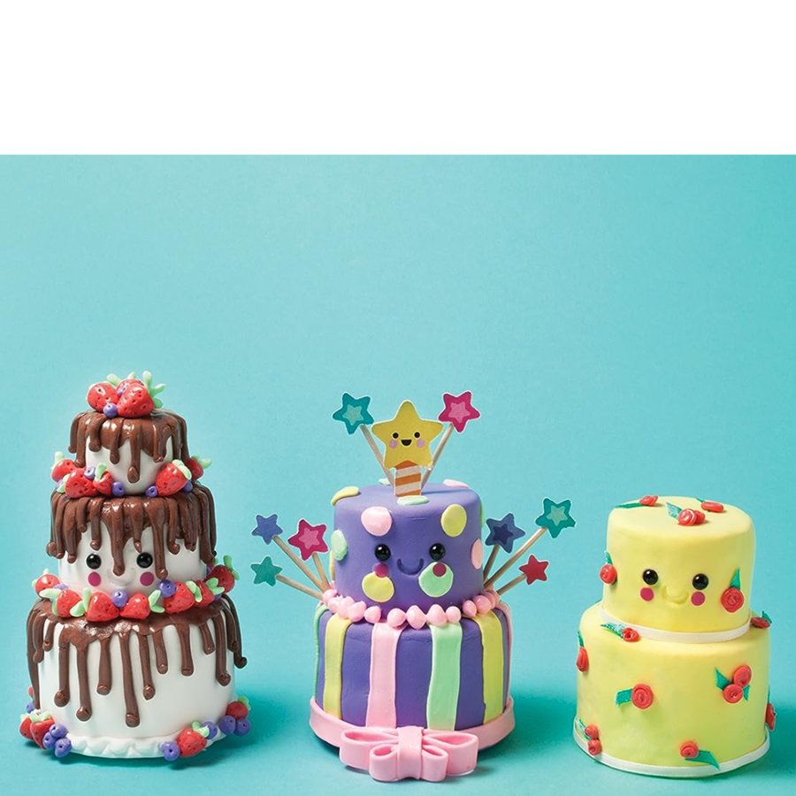Three colorful children's birthday cakes with star-shaped candles on a blue background