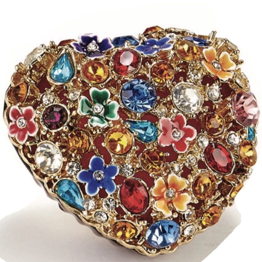 Decorative ring with colorful gemstones and floral designs on a white background