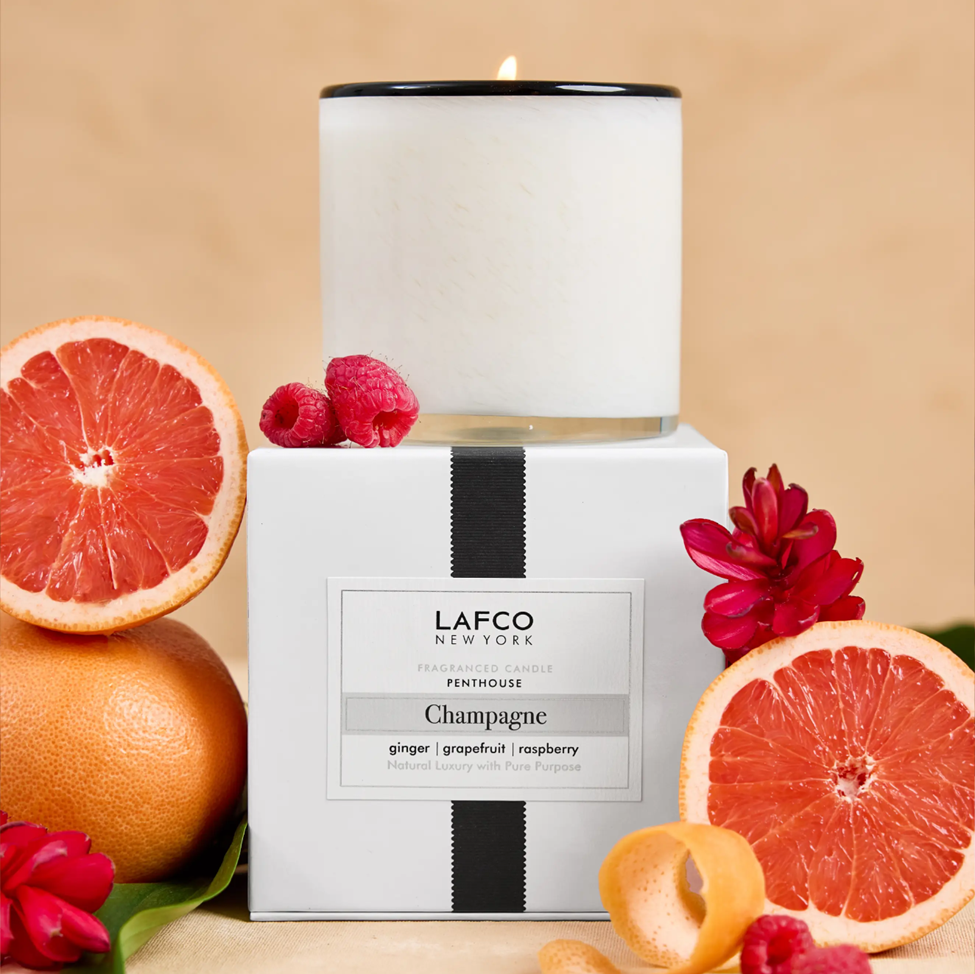 LAFCO candle with grapefruit and raspberry on a beige background