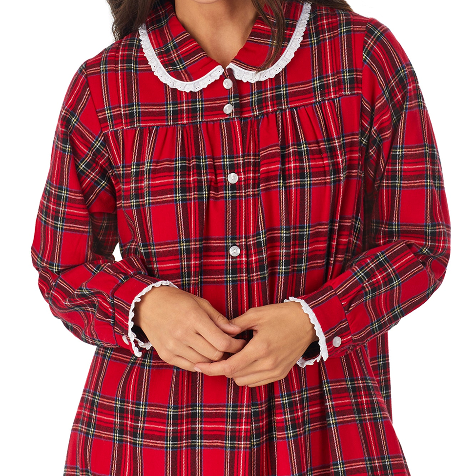 Red plaid dress with white lace trim on a white background