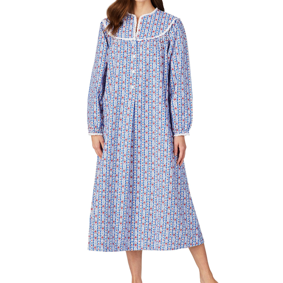 Woman wearing a blue patterned nightgown on a white background