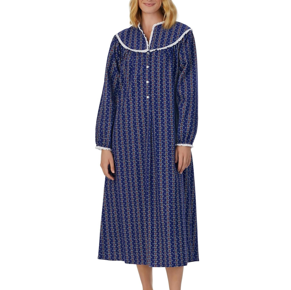Woman wearing a blue patterned nightshirt on a white background