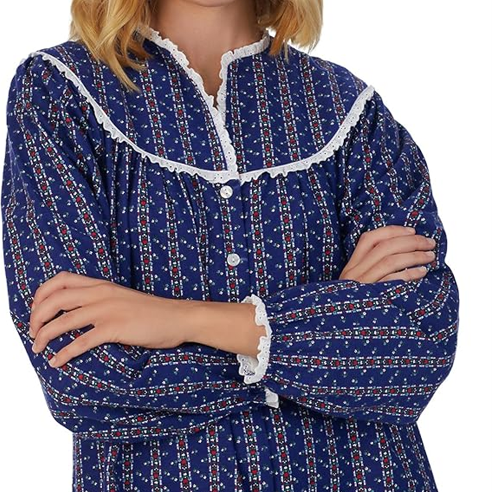 Blue patterned pajama top with white lace trim on a white background