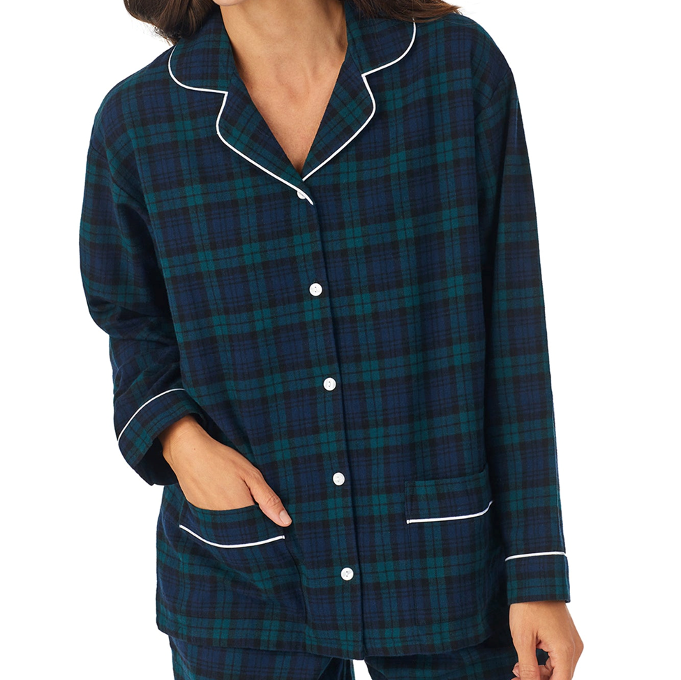 Navy and green plaid pajama set with white piping on a white background