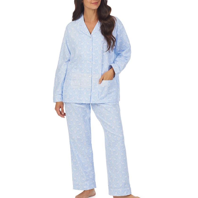 Woman wearing a light blue pajama set on a white background
