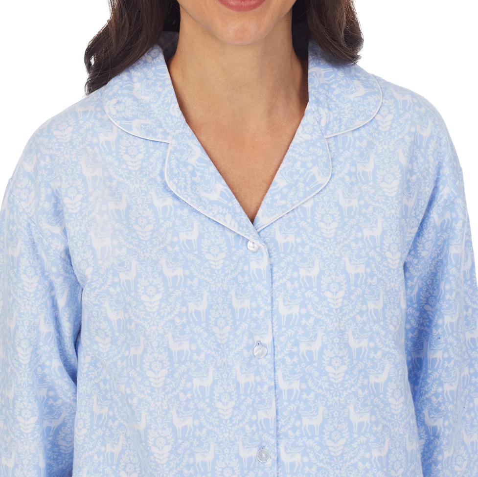 Light blue pajama top with a subtle pattern on a white background