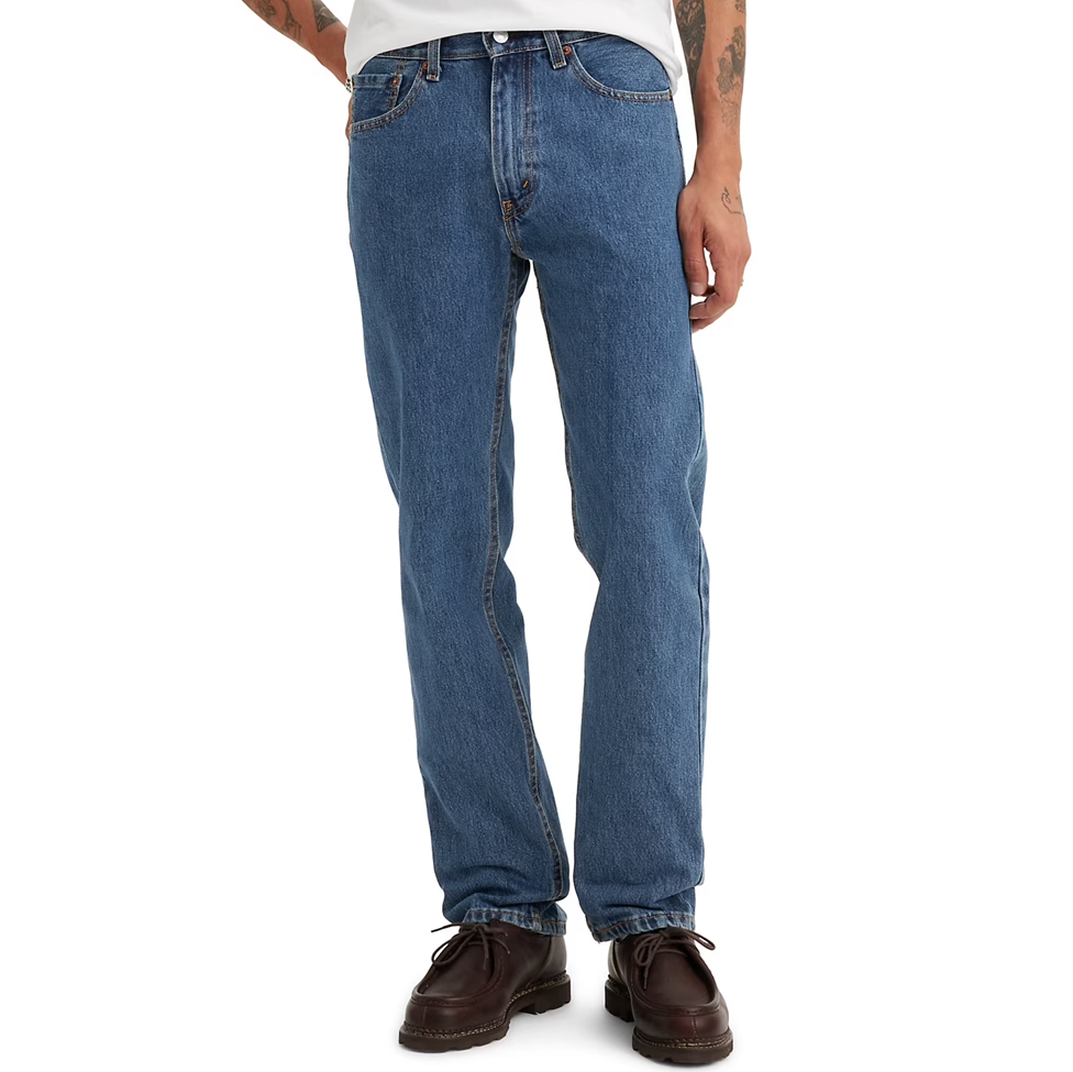 Blue jeans worn by a person on a white background